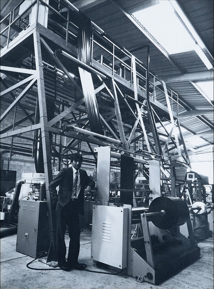 Paul Mehta at the Polyclear factory with polythene film production equipment.